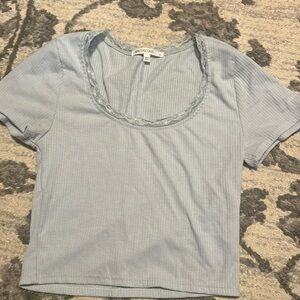 Blue cropped top with detailing around neck line